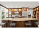Gourmet kitchen with island, stainless steel appliances, and custom cabinetry at 70 Riverside Dr, Ormond Beach, FL 32176