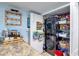 Stackable washer and dryer with adjacent pantry storage at 2937 S Atlantic Ave # 1504, Daytona Beach, FL 32118