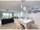 Bright dining area with table, chairs, and view into the living room at 2937 S Atlantic Ave # 1504, Daytona Beach, FL 32118