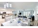 Bright dining area with table set for dinner, adjacent to kitchen at 2937 S Atlantic Ave # 1504, Daytona Beach, FL 32118