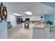 Modern kitchen featuring granite countertops and white cabinetry at 2937 S Atlantic Ave # 1504, Daytona Beach, FL 32118