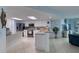 Bright kitchen with granite countertops, white cabinetry, and stainless steel appliances at 2937 S Atlantic Ave # 1504, Daytona Beach, FL 32118