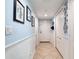 A condo hallway with light blue walls and white trim at 2937 S Atlantic Ave # 1504, Daytona Beach, FL 32118