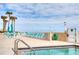 Oceanfront pool and deck area with lounge chairs and tables at 2937 S Atlantic Ave # 1504, Daytona Beach, FL 32118