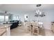 Charming dining area with a table for four and a modern light fixture at 2937 S Atlantic Ave # 1504, Daytona Beach, FL 32118