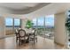 Bright dining room with a round table and chairs, offering stunning panoramic views at 2545 S Atlantic Ave # 1701, Daytona Beach Shores, FL 32118