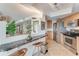 Kitchen with granite breakfast bar, stainless steel appliances, and ocean view at 2545 S Atlantic Ave # 1701, Daytona Beach Shores, FL 32118