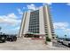 High-rise building exterior showcasing modern architecture and ample parking at 2545 S Atlantic Ave # 1701, Daytona Beach Shores, FL 32118
