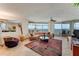 Living room with large windows, curved sofa and scenic ocean views at 2545 S Atlantic Ave # 1701, Daytona Beach Shores, FL 32118