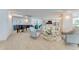 Relaxing lounge area featuring comfortable seating, a grand piano, and city views at 2545 S Atlantic Ave # 1701, Daytona Beach Shores, FL 32118