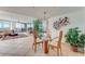 Open concept dining area with glass table, offering views to the living room at 2545 S Atlantic Ave # 1701, Daytona Beach Shores, FL 32118