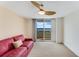 Bright living room with a comfortable sofa and sliding glass doors to balcony at 2545 S Atlantic Ave # 1701, Daytona Beach Shores, FL 32118