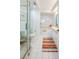 Bathroom with a bathtub, shower, and white tile at 4525 S Atlantic Ave # 1502, Port Orange, FL 32127