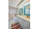 Double vanity bathroom with a large corner bathtub at 4525 S Atlantic Ave # 1502, Port Orange, FL 32127
