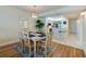 Elegant dining room with a table for six and hardwood floors at 4525 S Atlantic Ave # 1502, Port Orange, FL 32127