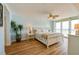 Bedroom with ocean views, light wood floors, and ceiling fan at 4525 S Atlantic Ave # 1502, Port Orange, FL 32127