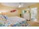 Beach-themed bedroom with a queen bed and en-suite bath at 4525 S Atlantic Ave # 1502, Port Orange, FL 32127