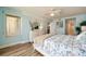 Bright bedroom with a queen-size bed and light blue walls at 4525 S Atlantic Ave # 1502, Port Orange, FL 32127