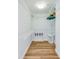 Walk-in closet with wire shelving and light wood floor at 4525 S Atlantic Ave # 1502, Port Orange, FL 32127