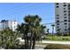 Ocean view with palm trees and residential buildings at 1510 Ocean Shore Blvd # 4140, Ormond Beach, FL 32176