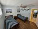 Guest bedroom with twin beds and ceiling fan at 1510 Ocean Shore Blvd # 4140, Ormond Beach, FL 32176