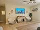 Relaxing living room featuring a large TV and comfortable seating at 1510 Ocean Shore Blvd # 4140, Ormond Beach, FL 32176