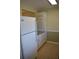 Simple kitchen with white cabinets and appliances at 1510 Ocean Shore Blvd # 4140, Ormond Beach, FL 32176