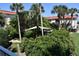 Lush courtyard with shade sail and tropical landscaping at 1510 Ocean Shore Blvd # 4140, Ormond Beach, FL 32176