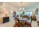 Charming dining area with a round table and chairs, offering ocean views at 4555 S Atlantic Ave # 4304, Ponce Inlet, FL 32127
