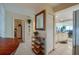 Hallway with built-in shelving and a view into the kitchen at 4555 S Atlantic Ave # 4304, Ponce Inlet, FL 32127