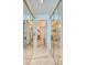 View of the bathroom with a hallway and mirrored closets at 4555 S Atlantic Ave # 4304, Ponce Inlet, FL 32127