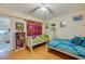 Bedroom with twin beds and built-in shelving at 4555 S Atlantic Ave # 4304, Ponce Inlet, FL 32127
