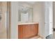 Bathroom with wood vanity, large mirror, and shower at 231 Riverside Dr # 2601-1, Daytona Beach, FL 32117