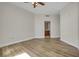 Bedroom with hardwood floors and access to bathroom at 231 Riverside Dr # 2601-1, Daytona Beach, FL 32117