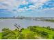 Aerial view showing waterfront property, pier, and city skyline at 231 Riverside Dr # 2601-1, Daytona Beach, FL 32117