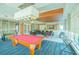 Community game room with pool table and seating area at 231 Riverside Dr # 2601-1, Daytona Beach, FL 32117