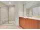 Bathroom with shower, vanity, and large mirror at 231 Riverside Dr # 2601-1, Daytona Beach, FL 32117