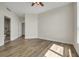 Bedroom with hardwood floors and access to bathroom at 231 Riverside Dr # 2601-1, Daytona Beach, FL 32117