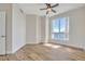 Bedroom with large window, city views, and ceiling fan at 231 Riverside Dr # 2601-1, Daytona Beach, FL 32117