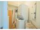 Stackable washer and dryer in a well-lit laundry room at 231 Riverside Dr # 2601-1, Daytona Beach, FL 32117