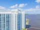 Aerial view of two waterfront condo buildings with balconies and a pool at 231 Riverside Dr # 2601-1, Daytona Beach, FL 32117