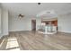 Open living area with hardwood floors and kitchen island at 231 Riverside Dr # 2601-1, Daytona Beach, FL 32117