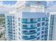 Close-up aerial view of condo building showcasing balconies and waterfront location at 231 Riverside Dr # 2601-1, Daytona Beach, FL 32117