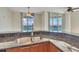 Kitchen with granite countertops, stainless steel appliances, and water views at 231 Riverside Dr # 2601-1, Daytona Beach, FL 32117
