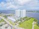 Wide aerial view of condo complex, parking, and waterfront property at 231 Riverside Dr # 2601-1, Daytona Beach, FL 32117