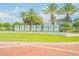 Welcome sign at entrance with palm trees and lush landscaping at 231 Riverside Dr # 2601-1, Daytona Beach, FL 32117