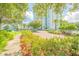 Landscaped entrance with palm trees and brick paved roadway at 231 Riverside Dr # 2601-1, Daytona Beach, FL 32117