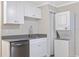 Updated kitchen with stainless steel appliances and white cabinets at 342 N Charles St, Daytona Beach, FL 32114