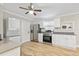 Kitchen with in-unit laundry, stainless steel appliances, and ample counter space at 342 N Charles St, Daytona Beach, FL 32114