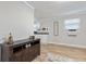 Living room with dark wood console table and light beige couch at 342 N Charles St, Daytona Beach, FL 32114